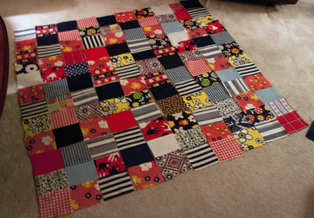 laying out quilt blocks on the floor