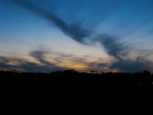 little plane, taking flight at sunset