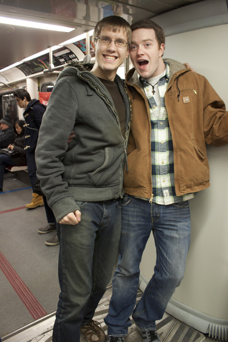 brad and mike on the toronto subway, excited about the accordion walls and moving floor