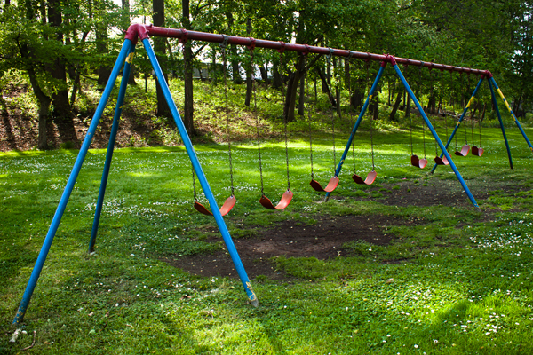 blue and red swings at cleveland's martin luther king jr. blvd