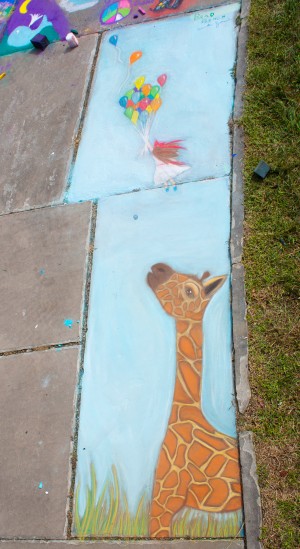 giraffe and girl with balloons at the cleveland chalk festival 2011