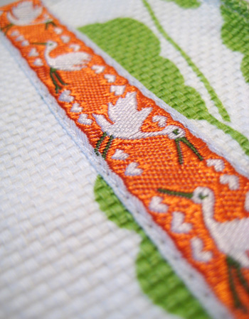 orange ribbon with geese and hearts