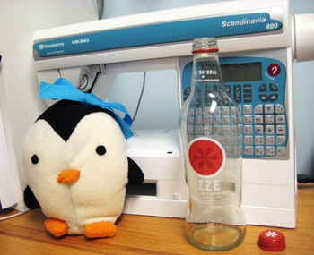 lily, izze bottle, and sewing machine