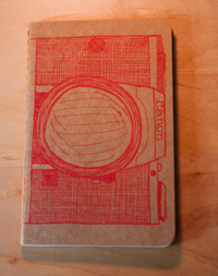 orange camera printed moleskine giveaway!