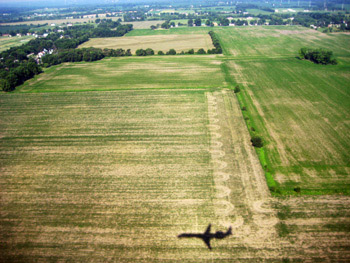plane’s shadow on the ground landing in dayton, ohio