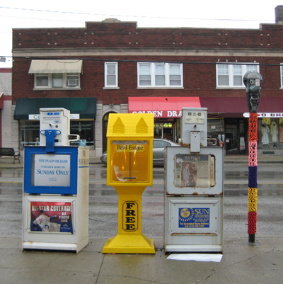 yarn-covered parking meter next to newspaper boxes, cleveland, ohio