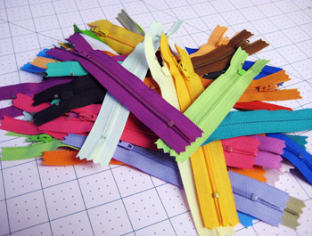 assorted colorful zippers