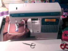 sewing machine in action - embroidering mini dan